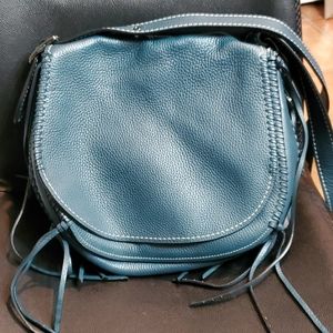 Coach crossbody bag with tassels teal